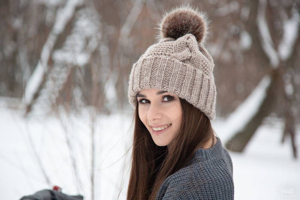 Teen model Leona Mia shows her tits and twat atop a snowmobile in the winter - #6