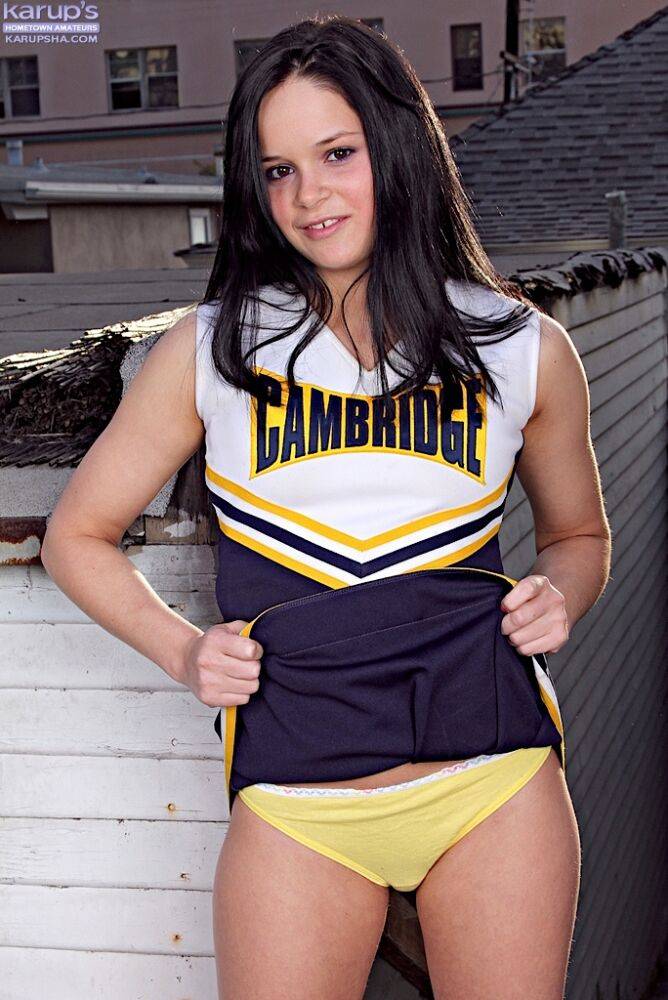 Teen cheerleader Jenna Ross doffs her uniform to pose nude on a rooftop patio - #3