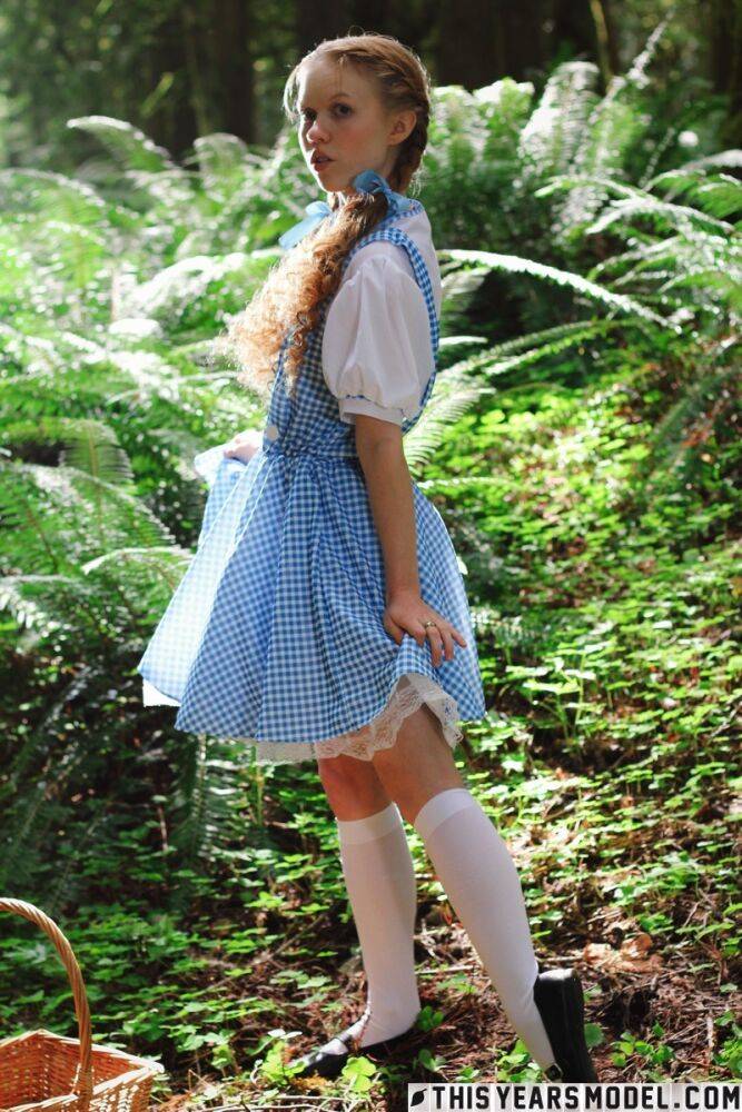 Charming redhead teen Dolly Little gets naked in white socks while in a forest - #15