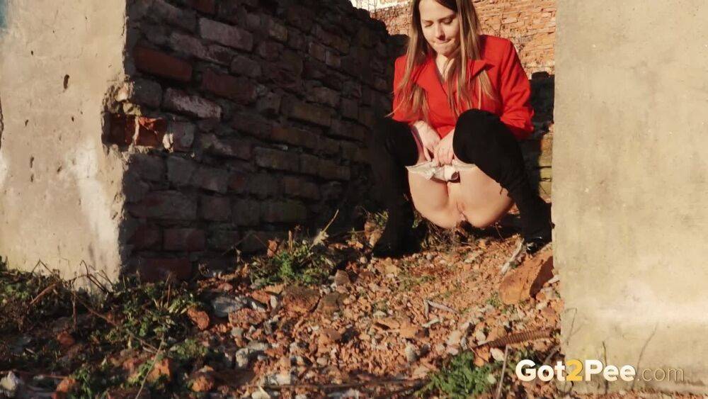Caucasian girl Nastya takes a piss behind the remnants of a brick house - #5