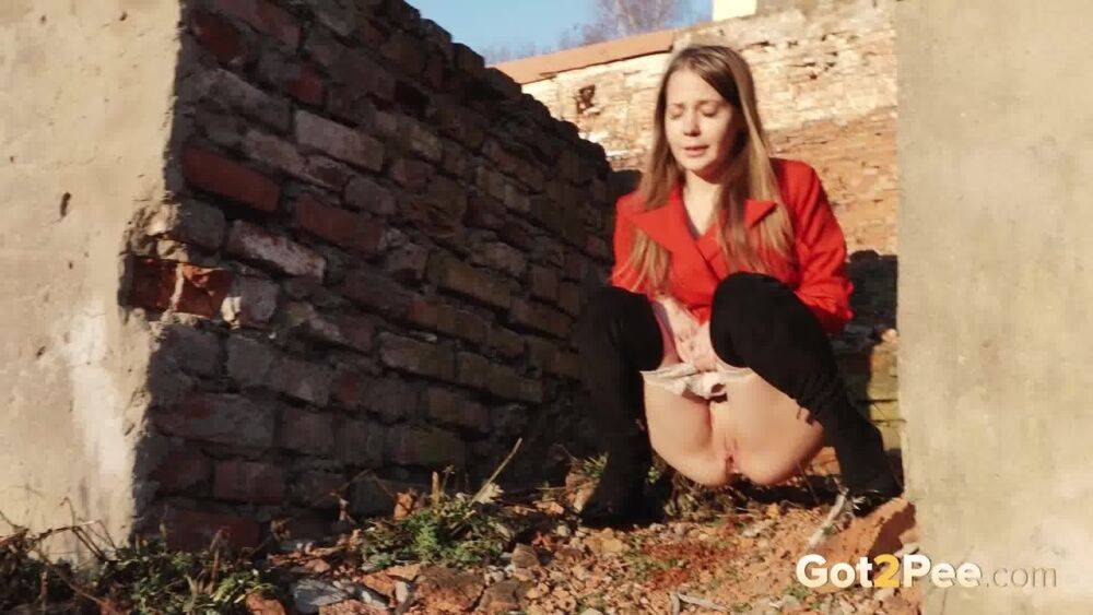 Caucasian girl Nastya takes a piss behind the remnants of a brick house - #7
