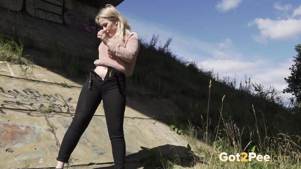 Blonde girl Nastya pulls down her pants for a badly needed pee in the outdoors - #7