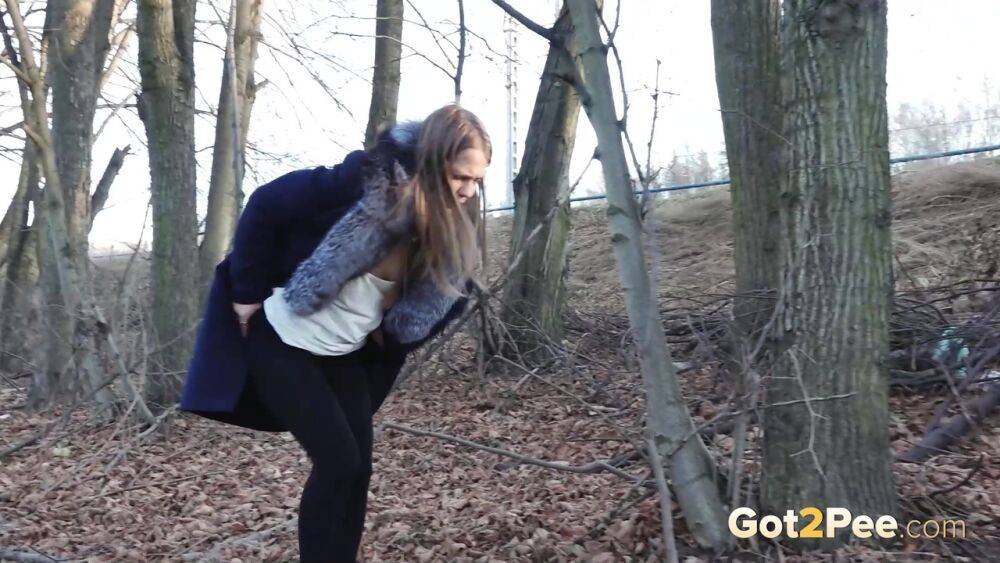 Short taken girl pulls down tights to take a pee while walking thru the woods - #12