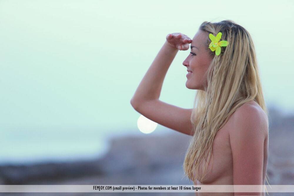 Blonde chick Liza K takes off her bikini at the beach prior to meditating - #14