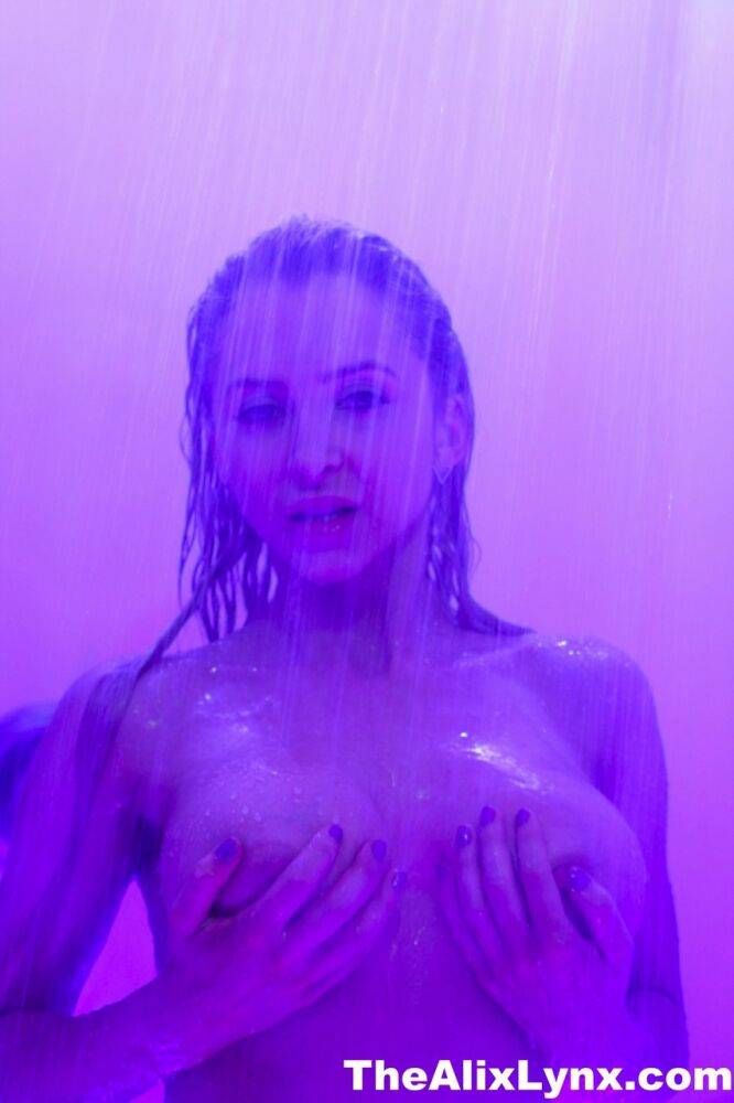 Alix Lynx presses her big tits against a shower stall while taking a shower - #1