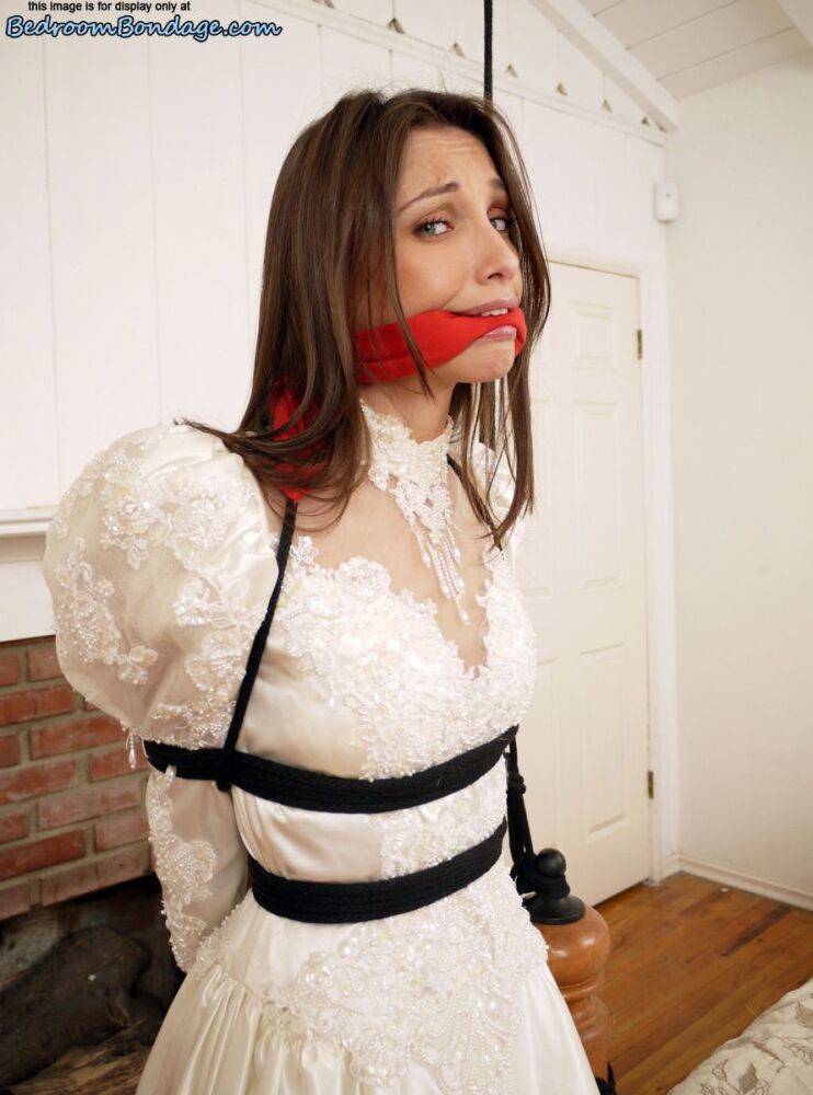 Brunette bride Celeste Star is ballgagged and tied up in her wedding dress - #14