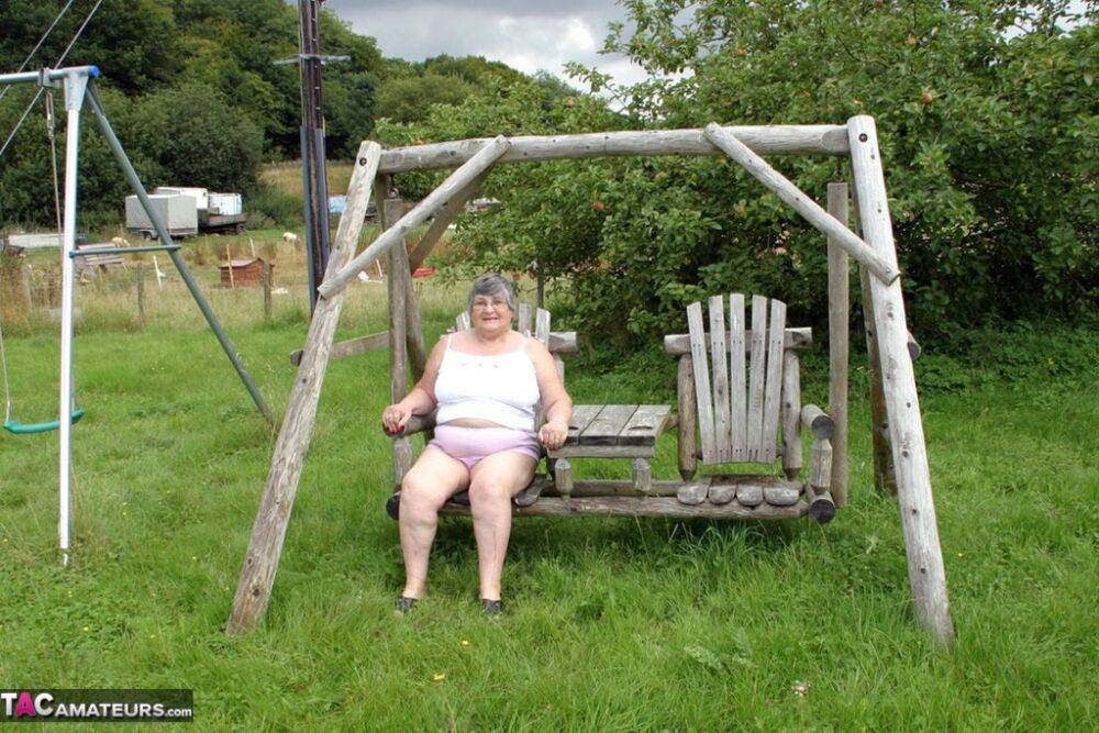 Old British woman Grandma Libby exposes her boobs on a backyard bench swing - #7