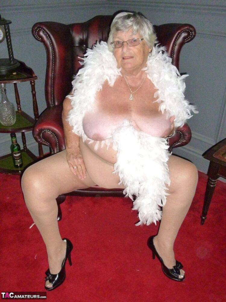 Fat nan Grandma Libby wears a feather boa while baring her saggy tits and butt - #3