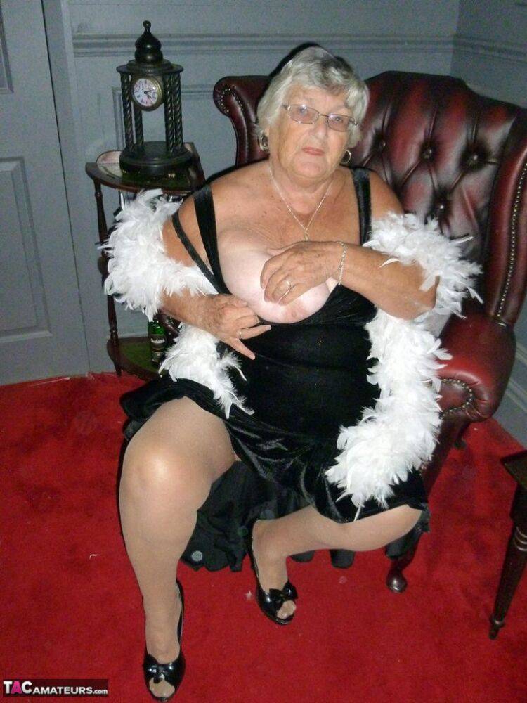 Fat nan Grandma Libby wears a feather boa while baring her saggy tits and butt - #5