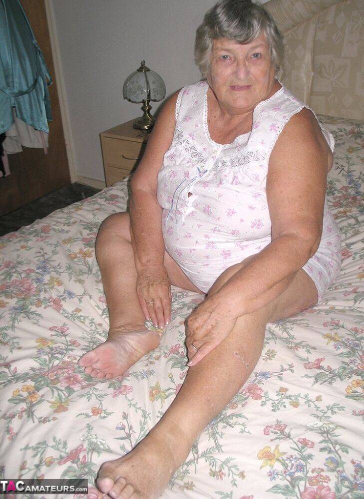 Old woman Grandma Libby grabs her fat roll after getting naked on a bed - #2