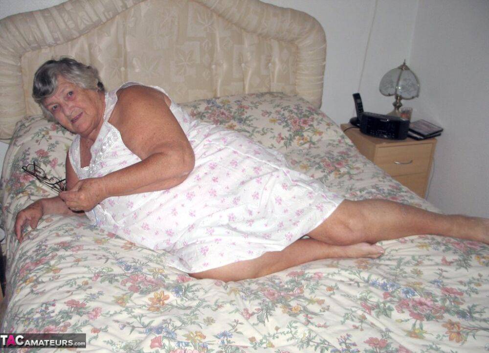 Old woman Grandma Libby grabs her fat roll after getting naked on a bed - #8