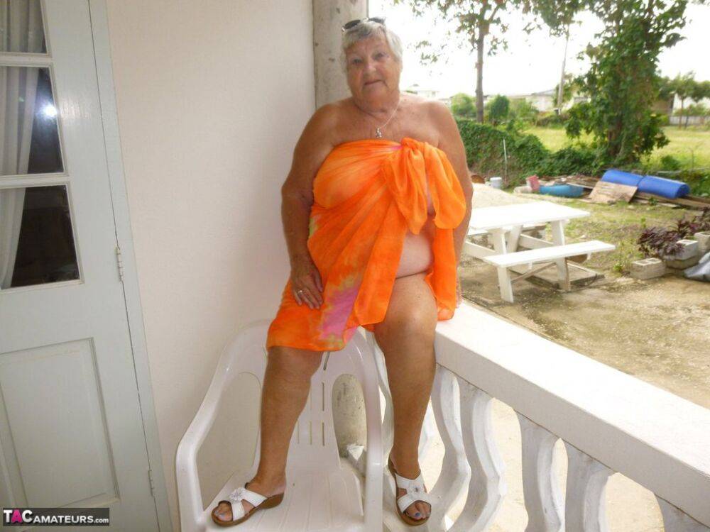 Fat oma Grandma Libby exposes her tan lined body on a balcony - #10