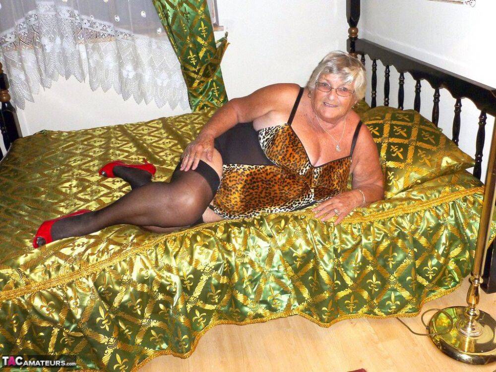 Old amateur Grandma Libby takes a big black dildo to her snatch on a bed - #7