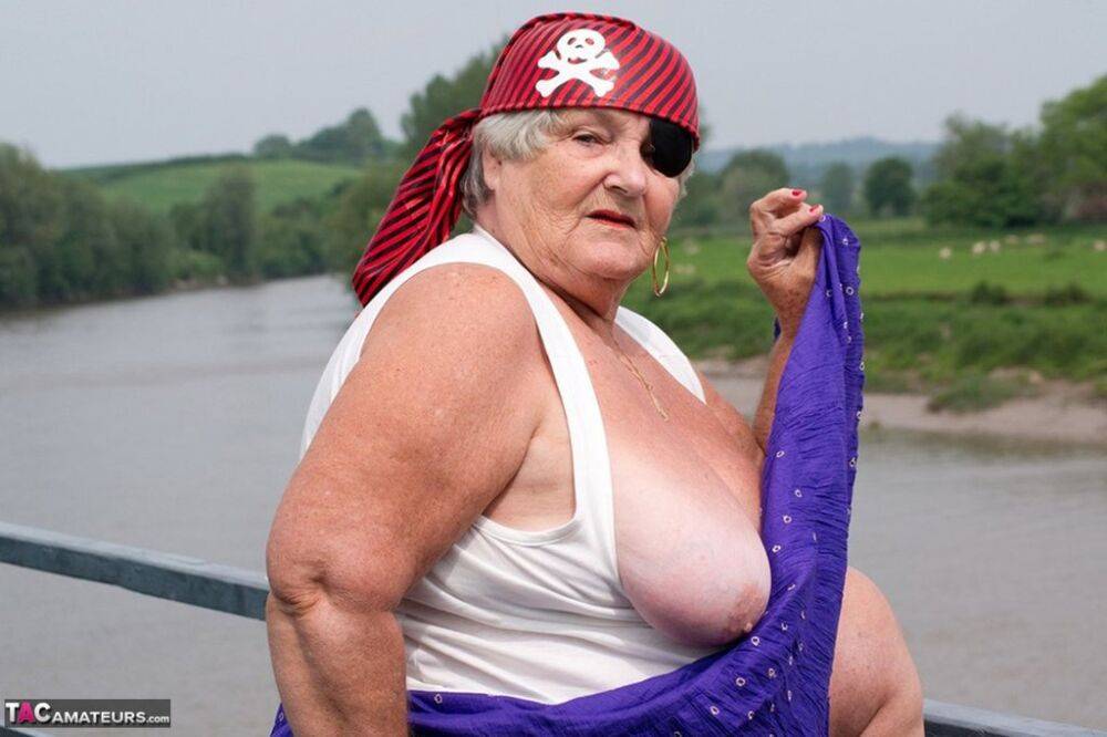 Fat British granny exposes herself on a bridge while sporting pirate attire - #7