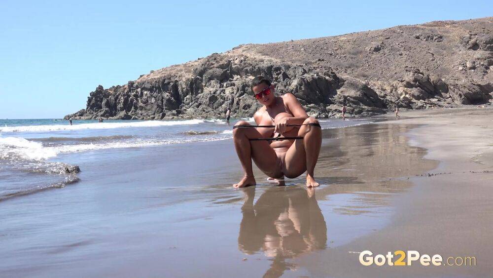 Big titted woman Chloe Lamour squats for a pee while walking on a beach - #6