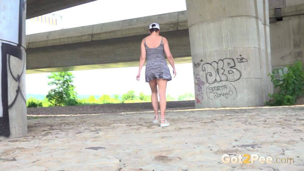 Chloe Lamour squats near a bridge to piss - #6