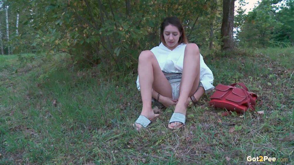 Brunette cutie squats to piss near the lake - #12