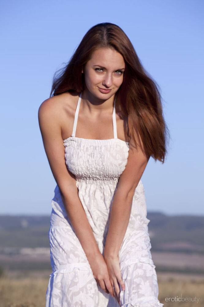 Young beauty Mishel C removes a white dress to model naked in a field - #15