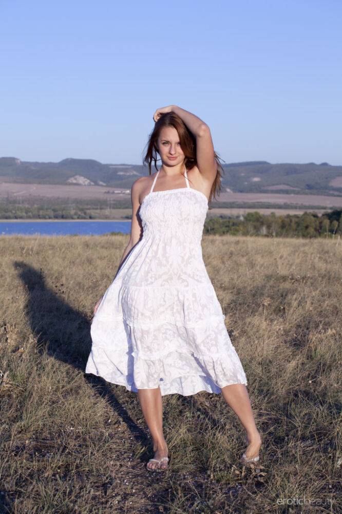 Young beauty Mishel C removes a white dress to model naked in a field - #16