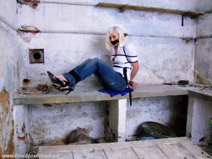 British woman is tied up and gagged in blue jeans and a white shirt - #10