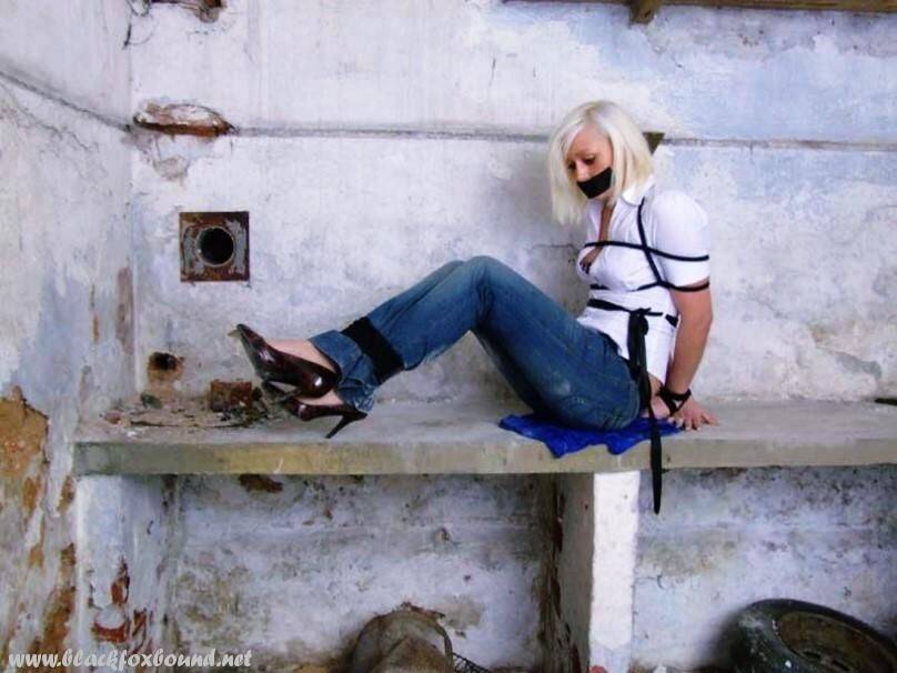 British woman is tied up and gagged in blue jeans and a white shirt - #5