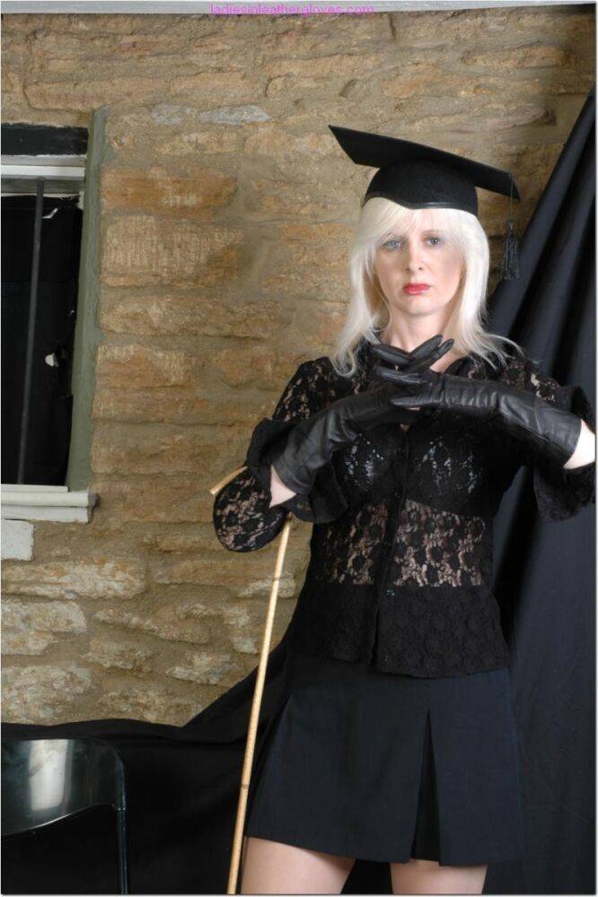 Platinum blond dons leather gloves before holding a cane during upskirt action - #10