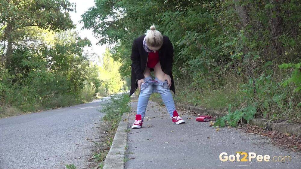 Pretty blonde Di Devi pulls down her jeans to pee on a public sidewalk - #10