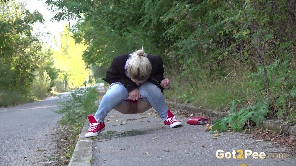 Pretty blonde Di Devi pulls down her jeans to pee on a public sidewalk - #7