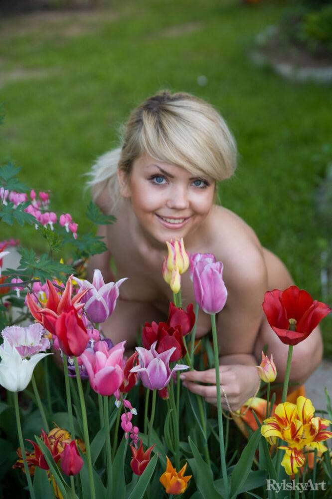 Cute young blonde Iveta poses in the nude while in a garden - #7