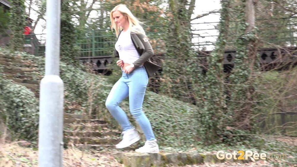 Young girl with long blonde hair Katy Sky pulls down her jeans to pee outside - #10