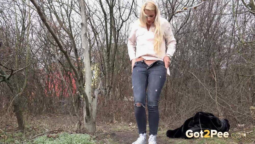 Blonde girl Katy Sky pulls down ripped jeans near leafless trees for a piss - #14