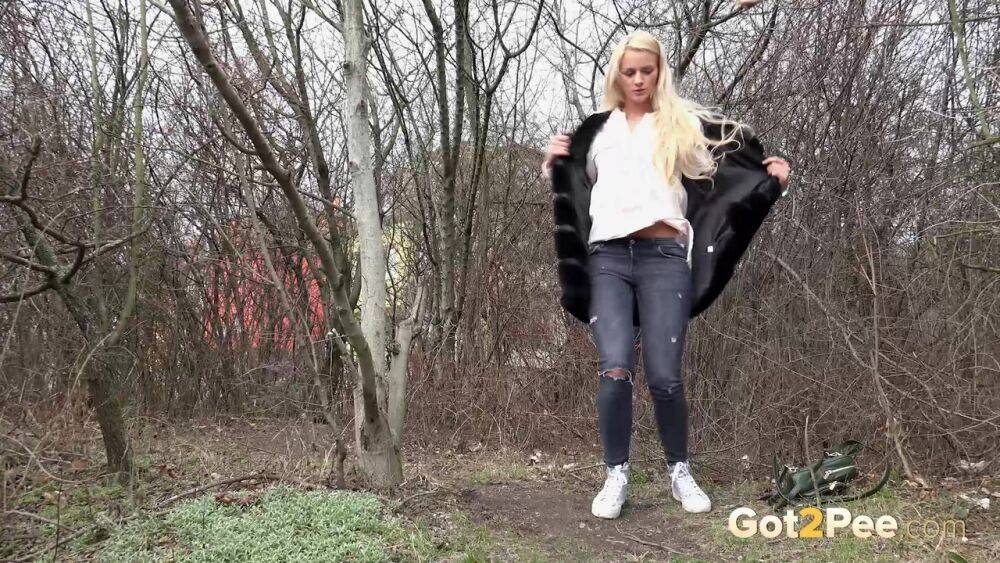 Blonde girl Katy Sky pulls down ripped jeans near leafless trees for a piss - #1
