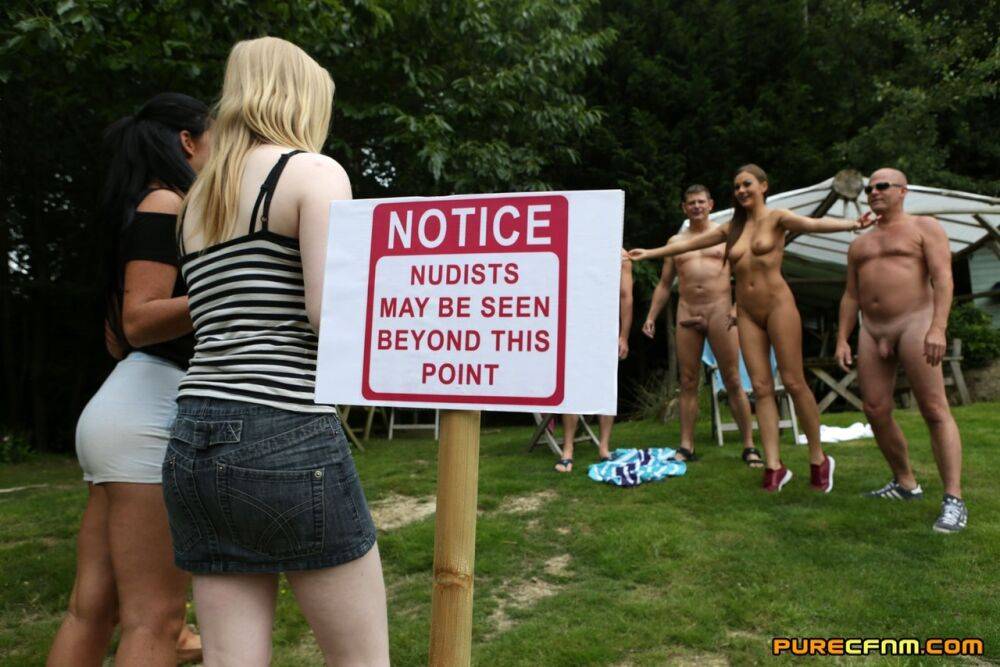 Lovely clothed female students blow off a nudist colony outdoors - #4