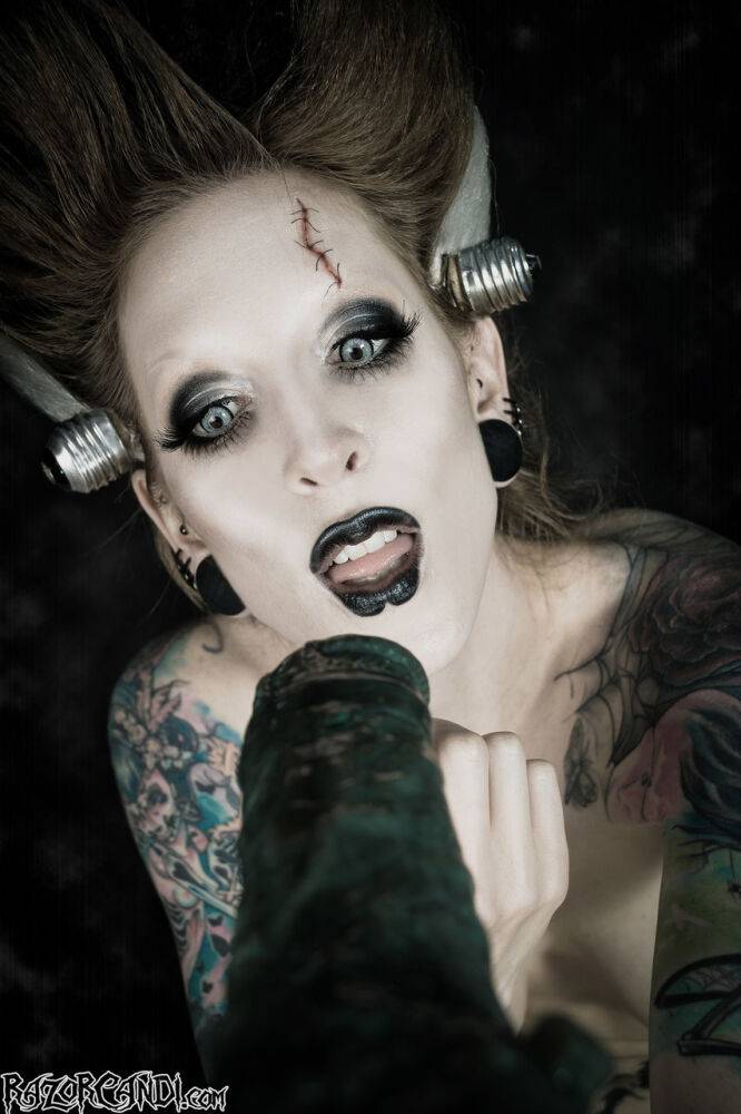 Tattoo model Razor Candi sucks on a big dildo in Bride of Frankenstein attire - #1