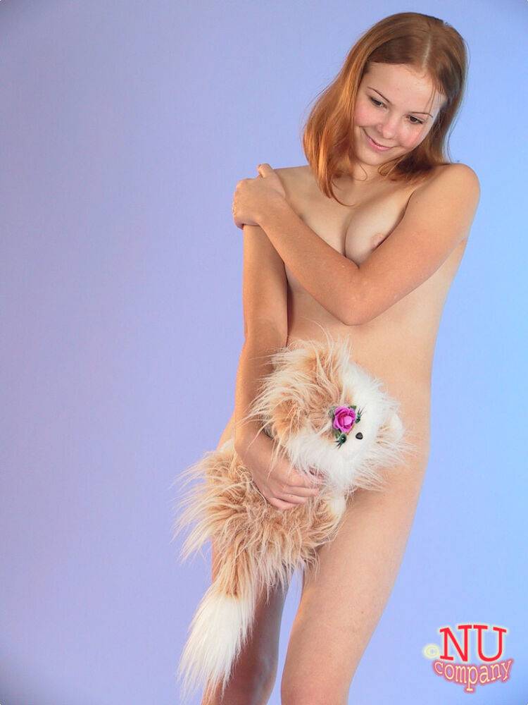 Cute redheaded teen Ola strips down naked and poses with her stuffed animal - #15