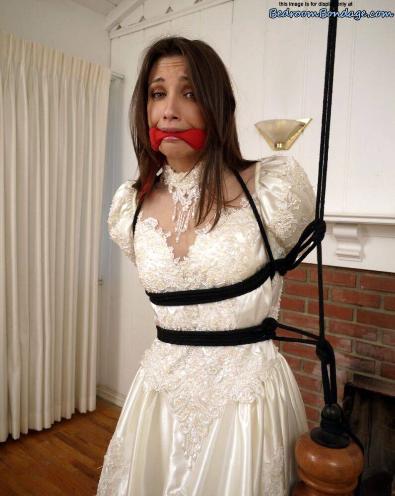 Brunette bride Celeste Star is ballgagged and tied up in her wedding dress - #4