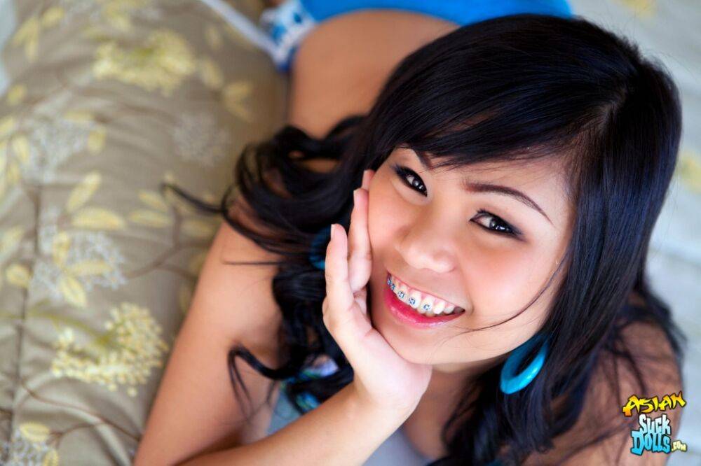 Asian girl with braces deepthroats a cock while having POV sex on her bed - #12