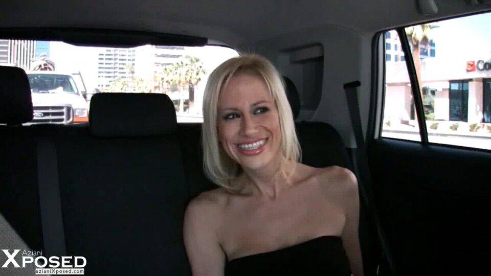 Blonde chick Kylie Worthy uncovers her big fake tits while in a vehicle - #16