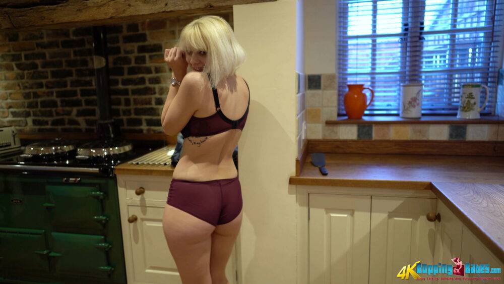 Cute blonde puts her big boobs on display after getting naked in her kitchen - #10
