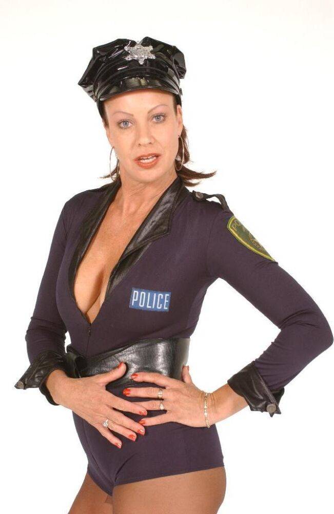 Fierce dominatrix dons her slutty police uniform and bares her big breasts for - #9