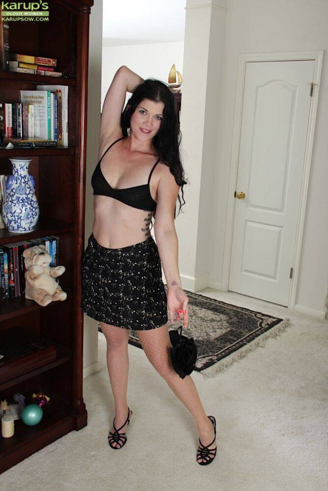 Solo strip scene by brunette milf named Veronica Stewart in sexy skirt | Photo: 4256785