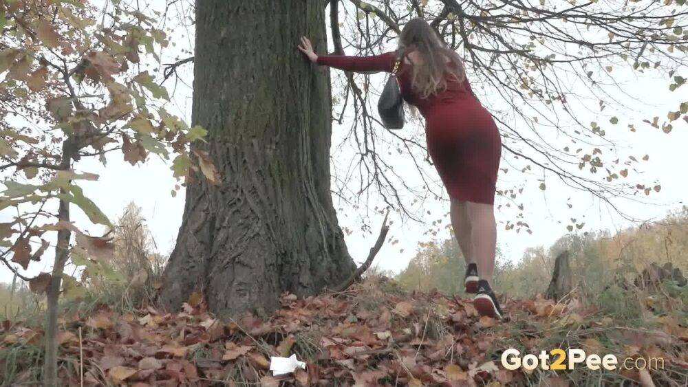 Distressed girl Sasha S hikes up her long dress to pee beside an old tree - #6