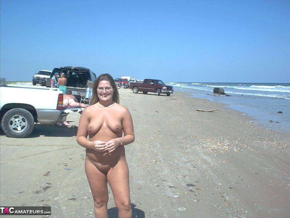 Glasses wearing amateur BBW gets gangbanged on a nude beach - #13