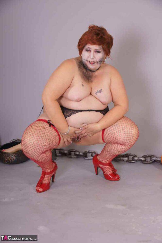 Redheaded BBW Lexie Cummings doffs cosplay wear to pose nude in mesh nylons - #13