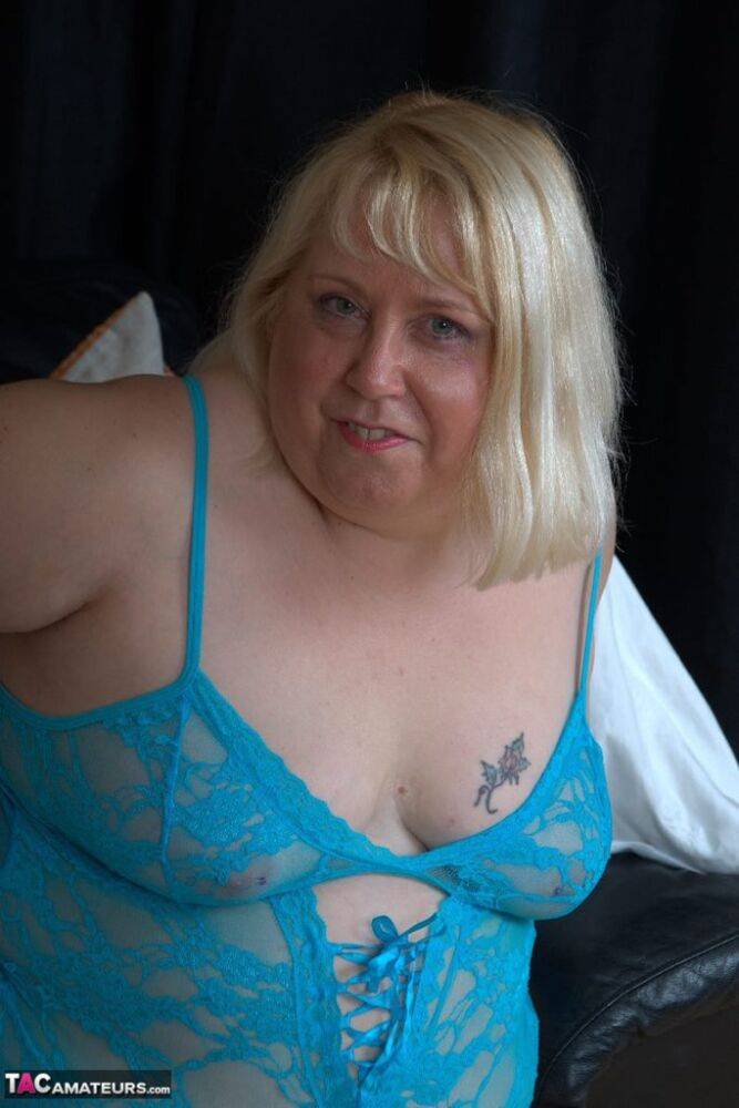 Aged UK blonde Lexie Cummings displays her pierced pussy in blue nylons - #4