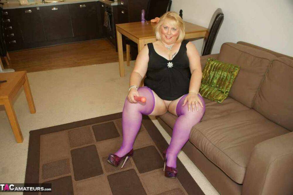 Fat British amateur Lexie Cummings masturbates on a loveseat in purple nylon | Photo: 4395099