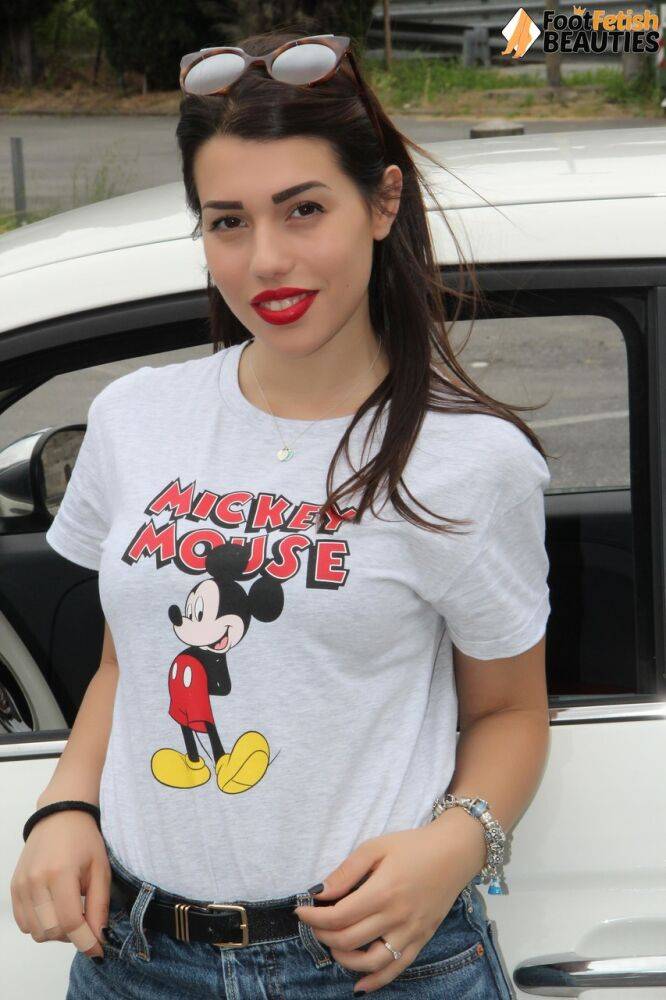 Hot girl displays her sexy feet in a car while wearing a Mickey Mouse T-shirt - #5