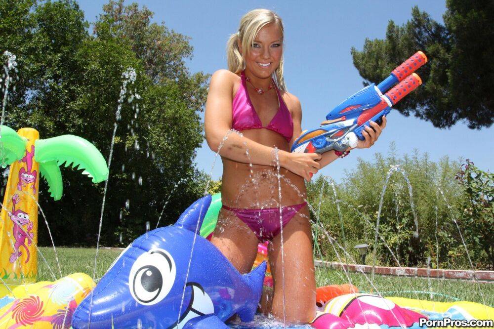 Young blonde Ally Kay ends a water fight by having sex in backyard - #1