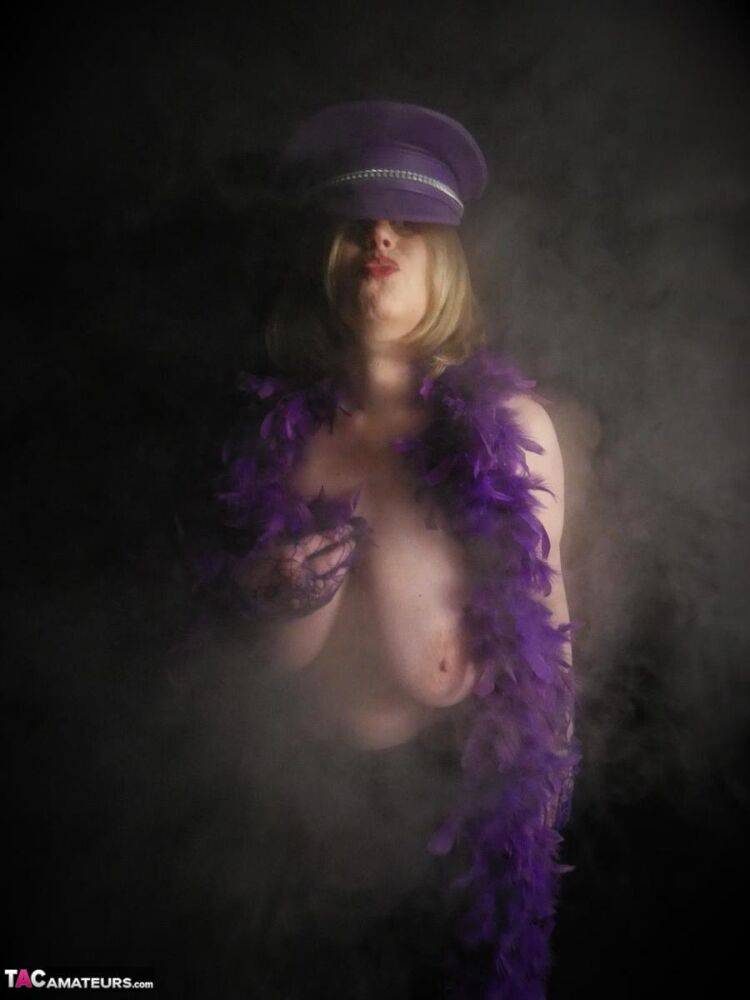 Mature woman Posh Sophia displays her huge boobs in a fetish themed hat - #3