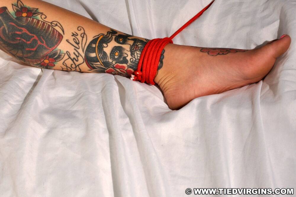 Tattooed blonde sports a ball gag while tied to a bed in the nude - #5